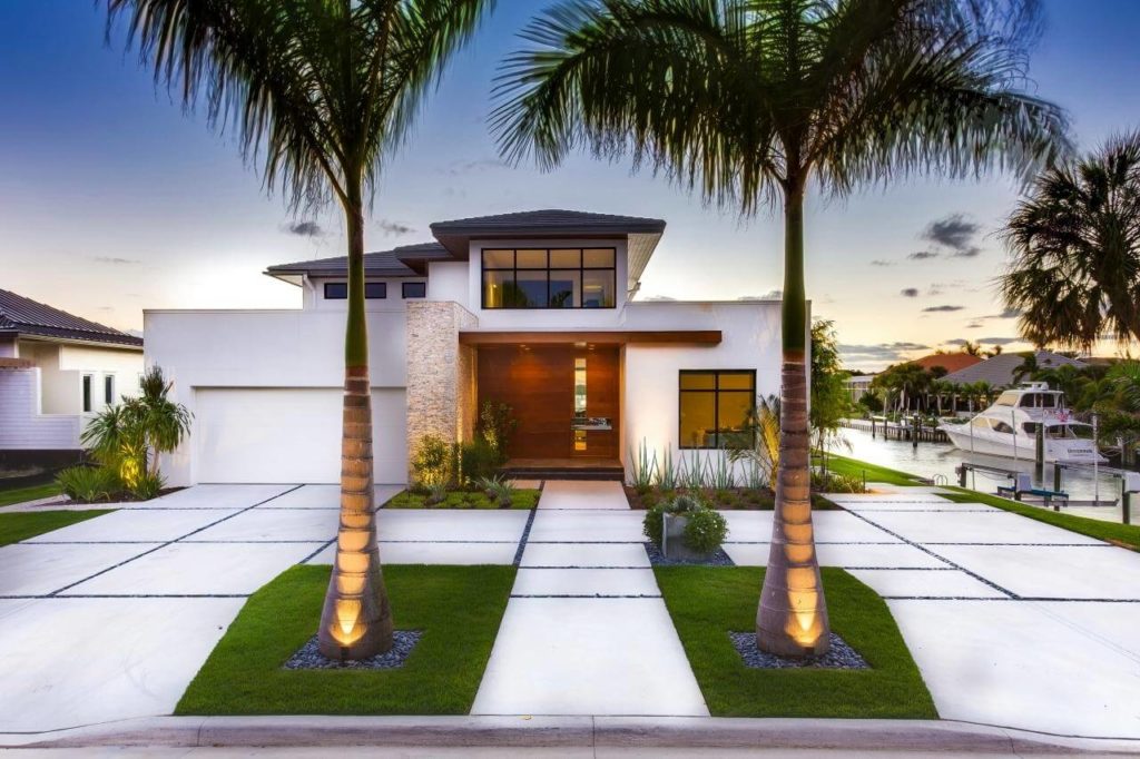 Modern white House minimalistic Front Yard Landscaping Ideas with tree in front 