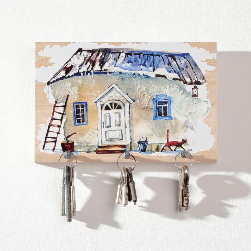 wooden key rack with a country home painting