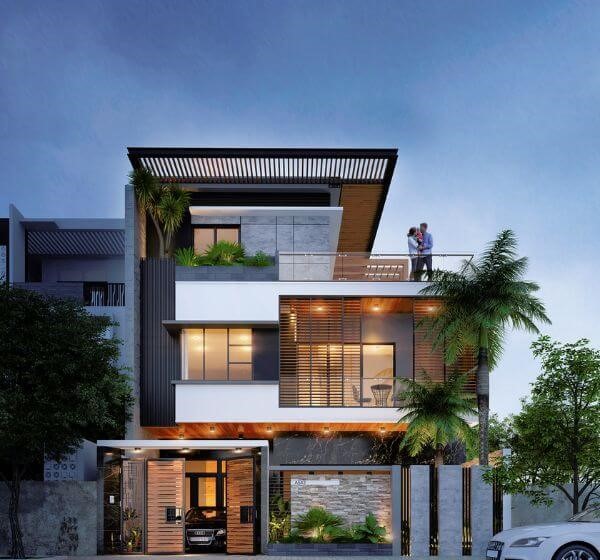 3 storey modern house design glass outer and amazing Lighting with couple standing on roof and car passing by road