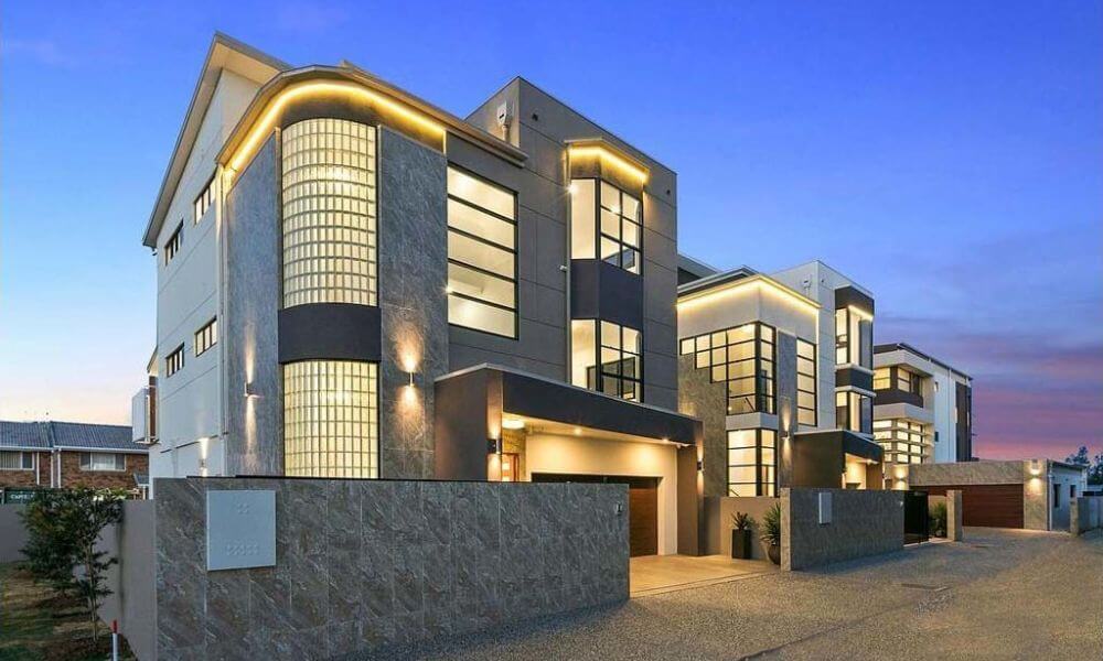 modern 3 floor house design with mesmerizing curved lighting in beautiful evening