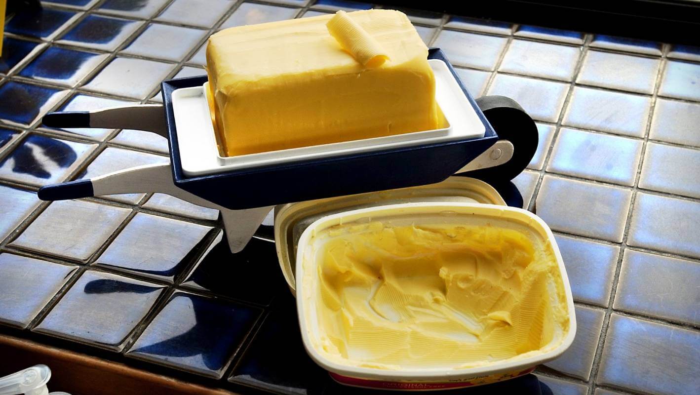 A piece of fresh butter on the table with rosemary and garlic Desktop wallpapers