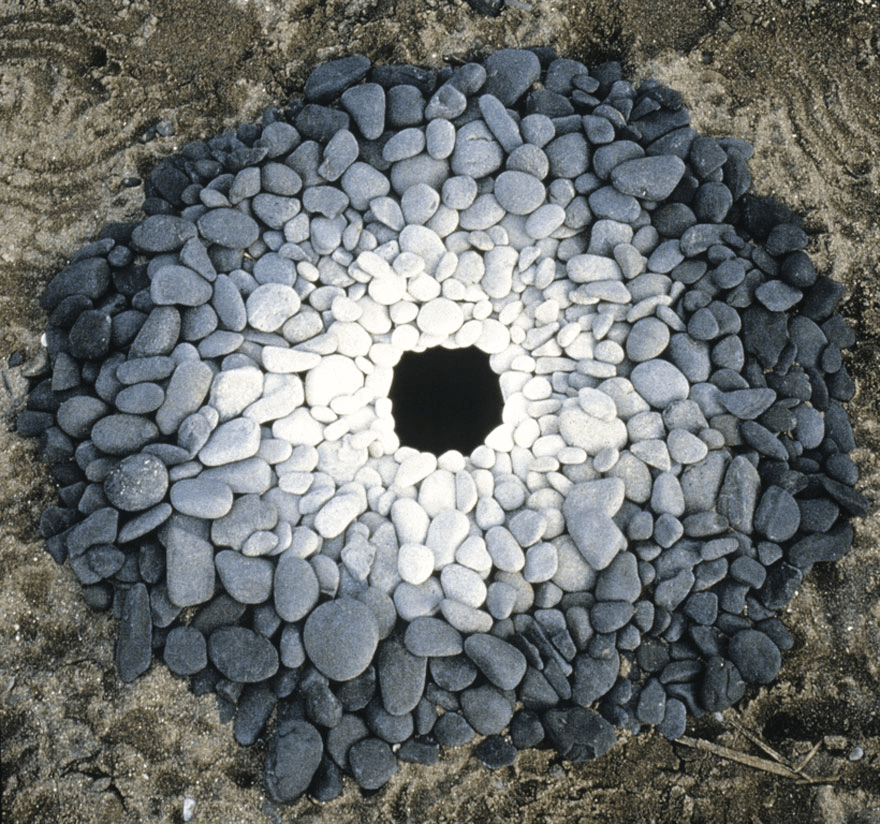 Andy Goldsworthy's magical land art - a circle created with white stones.