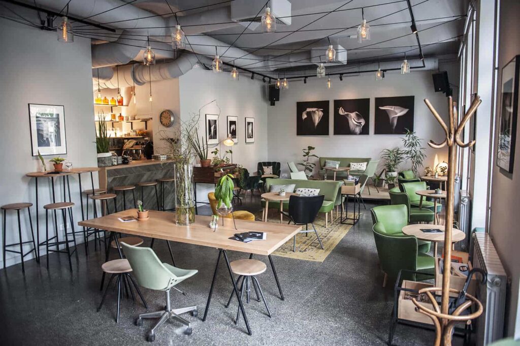 Aesthetic White and grey tone cultural cafe theme with wooden table and sitting area 