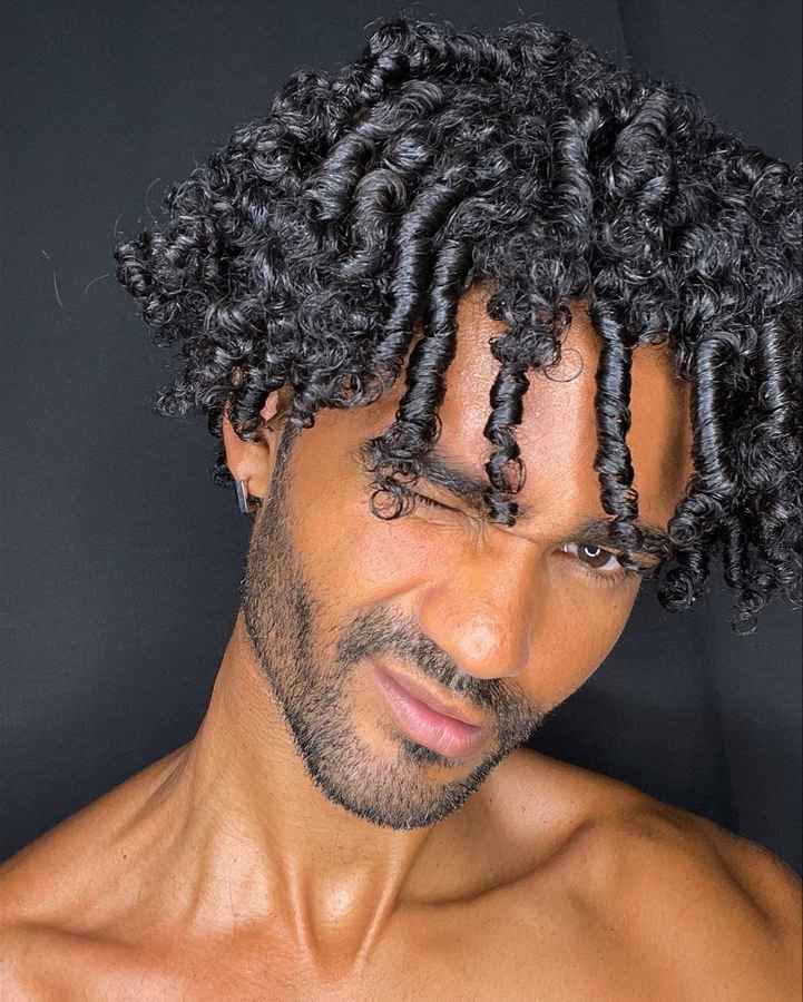 a men selfie showing his Black colour Curly Dreadlocks