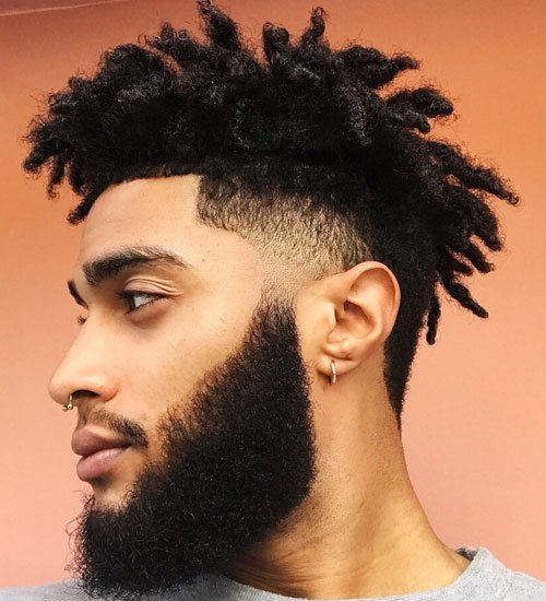Short Dreads style facing Left Side men hairstyle with basic fade and proper Beard