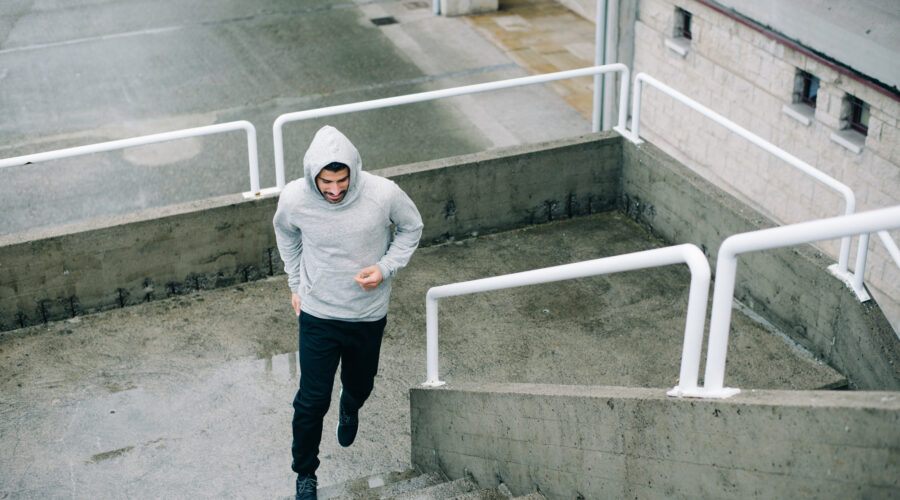 Man running on urban stairs