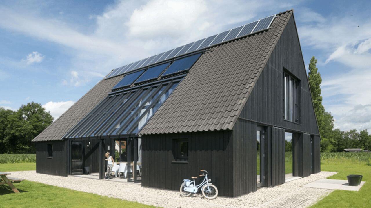 Classic Black Sustainable House Design with A shape roof and Window, Solar on it