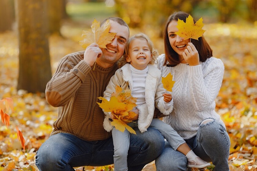 Family Halloween photoshoot in park with Smiling face and Autumn Outfit