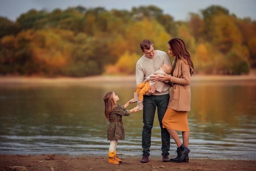 happy family walk autumn day and doing photoshoot near Lakes