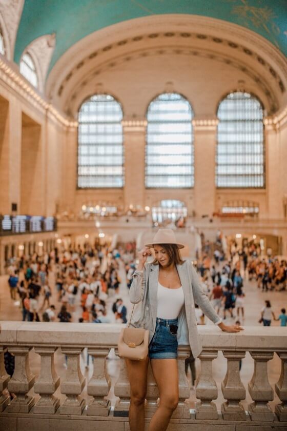 Girl Wearing White and denim Short Pose inside The Whispering Gallery in Grand Central Terminal 