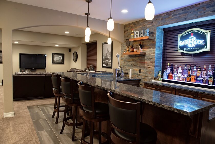 Rustic Basement bar With Wine and Chic hanging Light