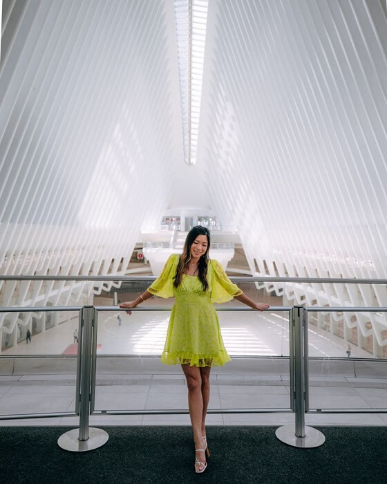 Women Wearing Green Skirt Pose Inside The Oculus