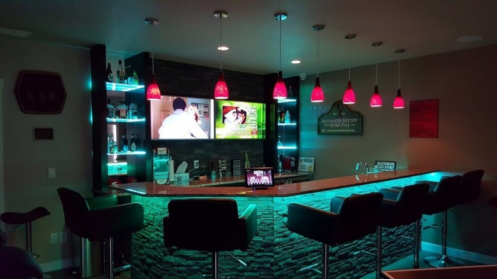 Neon Light Under bar Table with TV in basement 