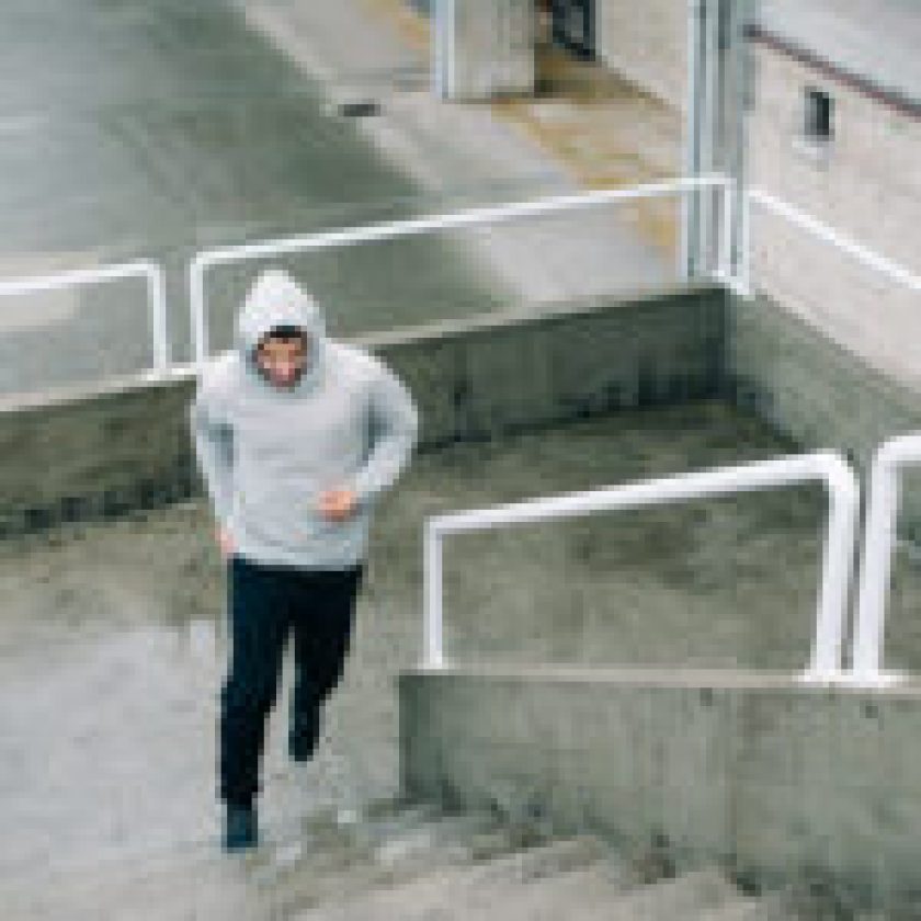 Man running on urban stairs
