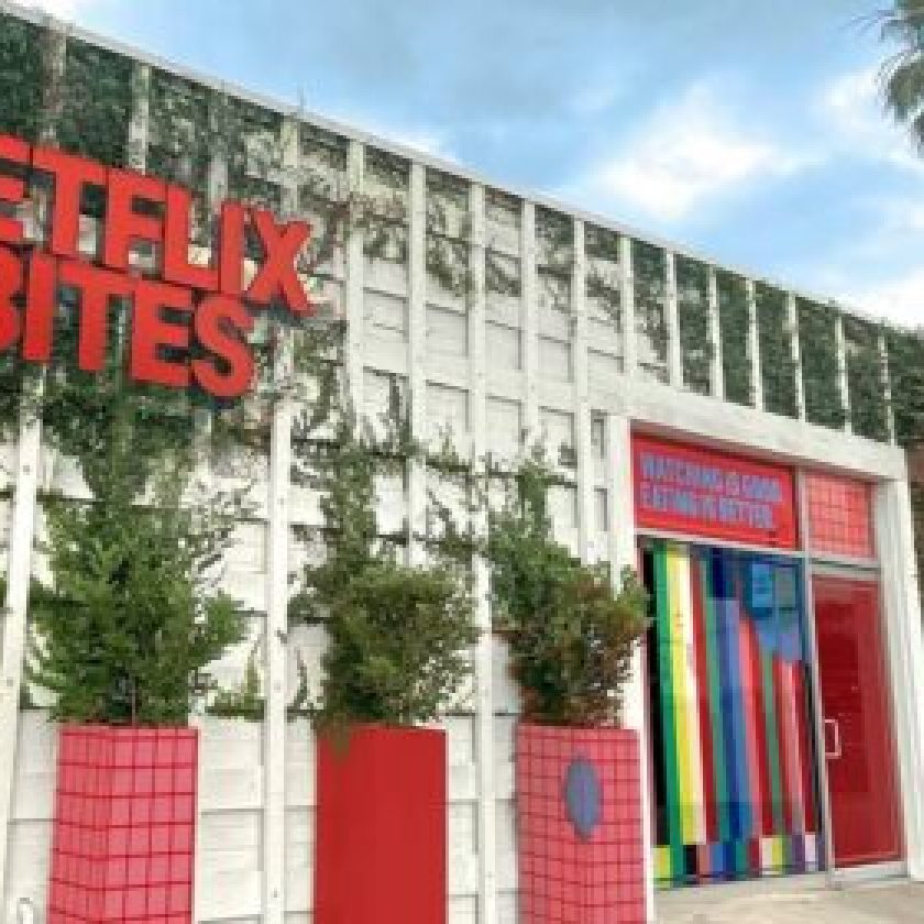 Netflix Bites Pop-Up Restaurant front Entry side with netflix intro vibe and grass all around it